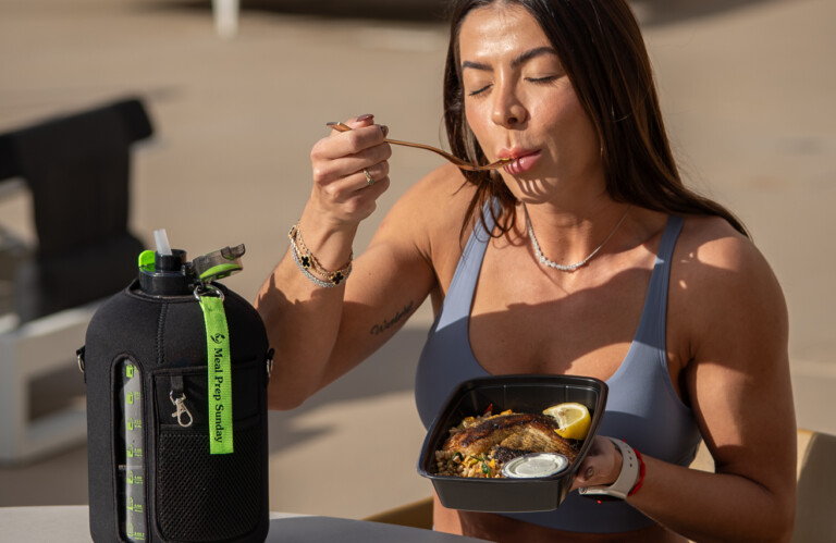 Influencer eating Meal Prep Sunday meal while sharing video testimonial experience.