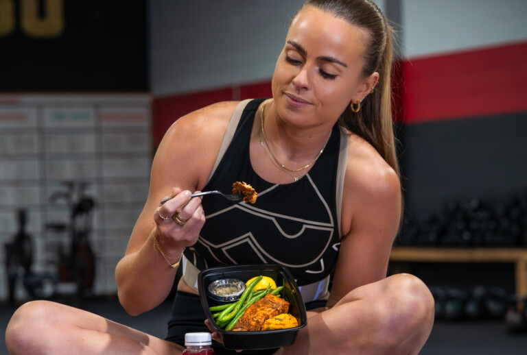 Influencer enjoying salmon meal prep.