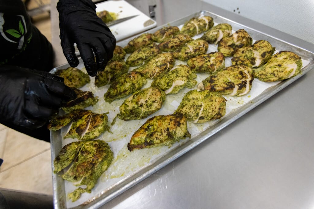 Sweet chicken meal prep laid out on tray before cooking