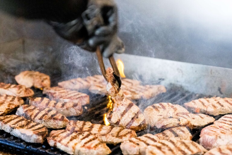 Sizzling meat that is freshly cooked before meal prepped.