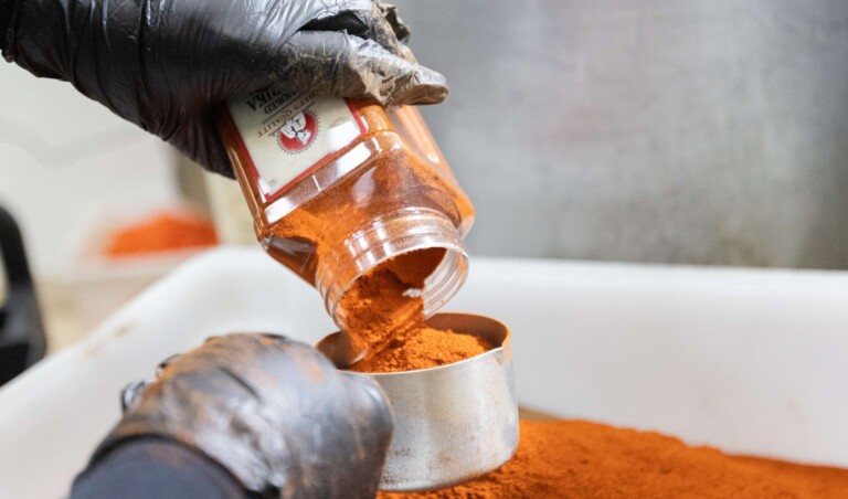 Tumeric being poured by Meal Prep Sunday Chefs.