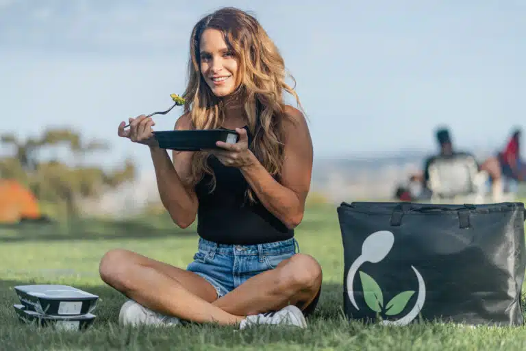 Smiling woman enjoying a healthy Meal Prep Sunday dish at home
