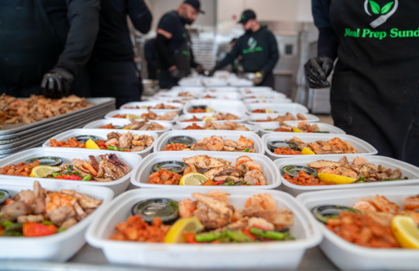 Rows of portioned Meal Prep Sunday meals with grilled chicken, shrimp, and vegetables for diabetic-friendly meal prep